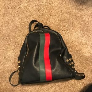 Black little backpack with stripes